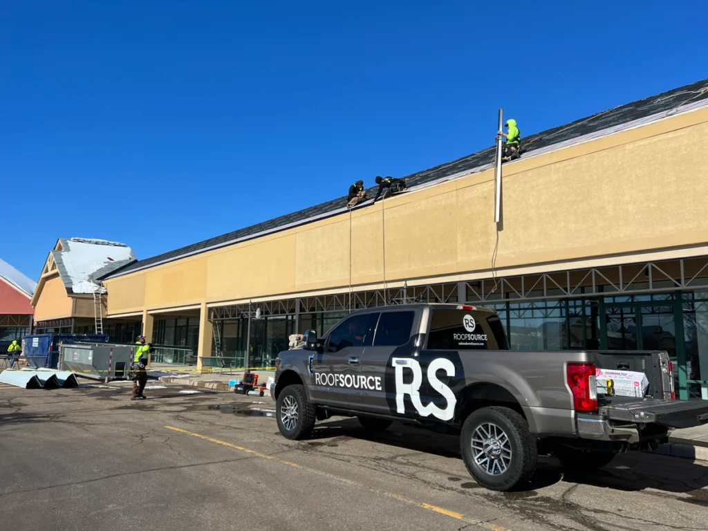 Roof Source contractors fixing a commercial roof